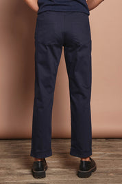 Model Amanda wearing size 10 of The Teachers Cotton Pant With Pockets in colour Honorblue (Blue), from the back