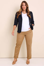 Model Lauraw wearing size 14 of the The Teachers Cotton Pant With Pockets - Sandstone in colour Sandstone, from the front