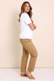 Model Lauraw wearing size 14 of the The Teachers Cotton Pant With Pockets - Sandstone in colour Sandstone, from the front