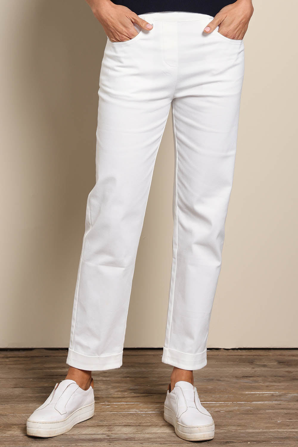 Model Amandam wearing size 10 of the The Teachers Pant With Pockets – White in colour White, in a cropped view