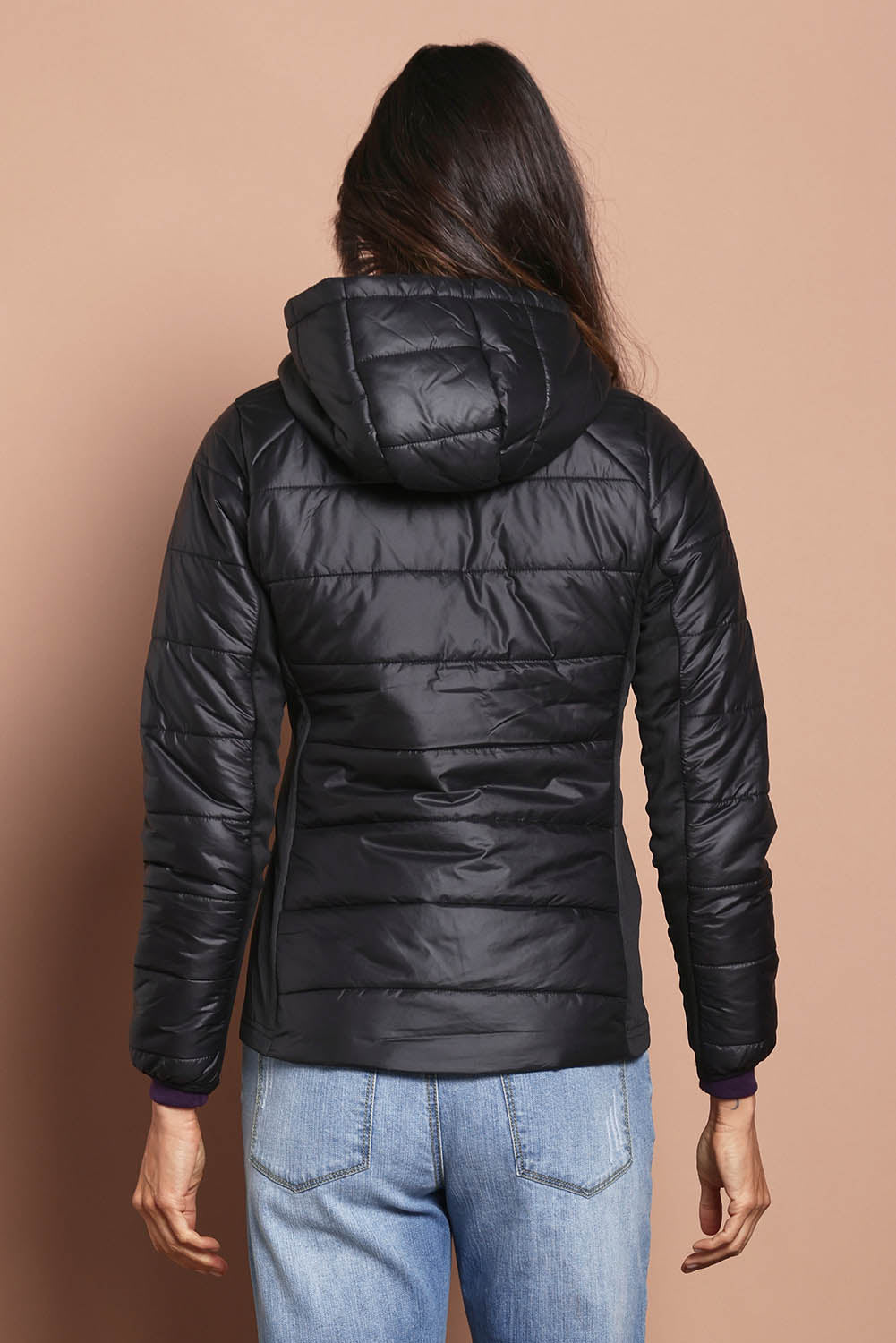 Model Amanda wearing size S of The Keepers Puffer Jacket in colour Black (Black), from the back