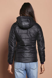 Model Amanda wearing size S of The Keepers Puffer Jacket in colour Black (Black), from the back