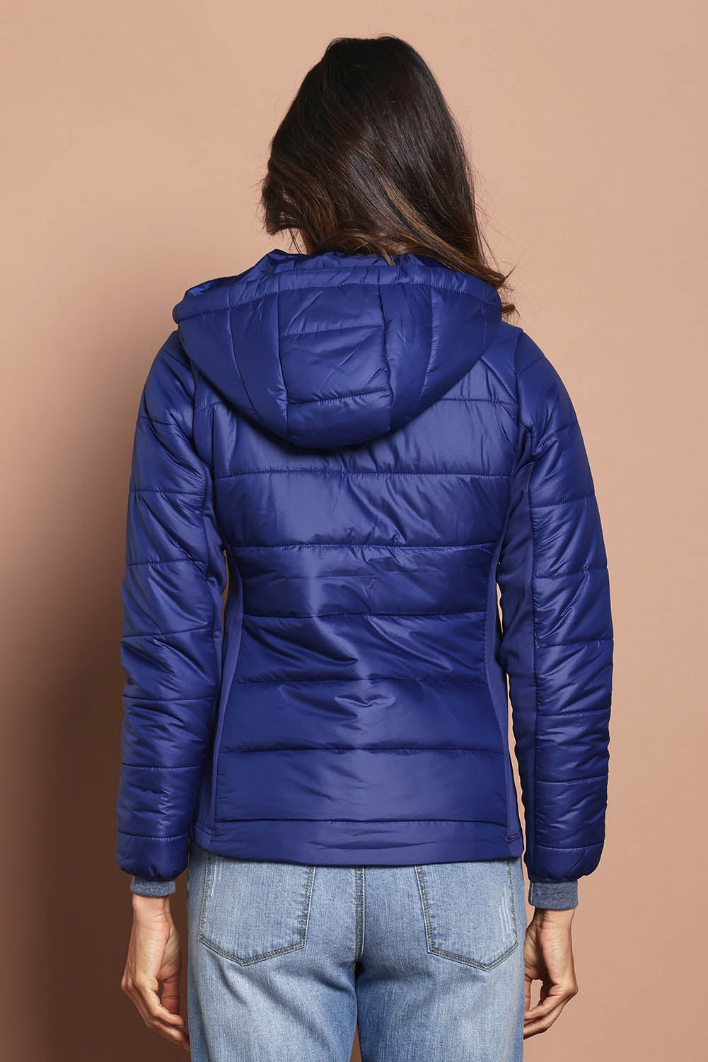 Model Amanda wearing size S of The Keepers Puffer Jacket in colour Navy (Blue), from the back