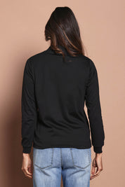 Model Amanda wearing size 10 of The Cotton Blend Skivvy in colour Black (Black), from the back
