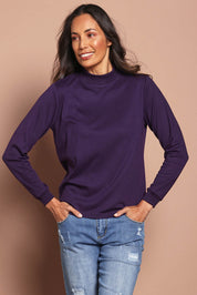 Model Amanda wearing size 10 of The Cotton Blend Skivvy in colour Grape (Purple), from the front, cropped image