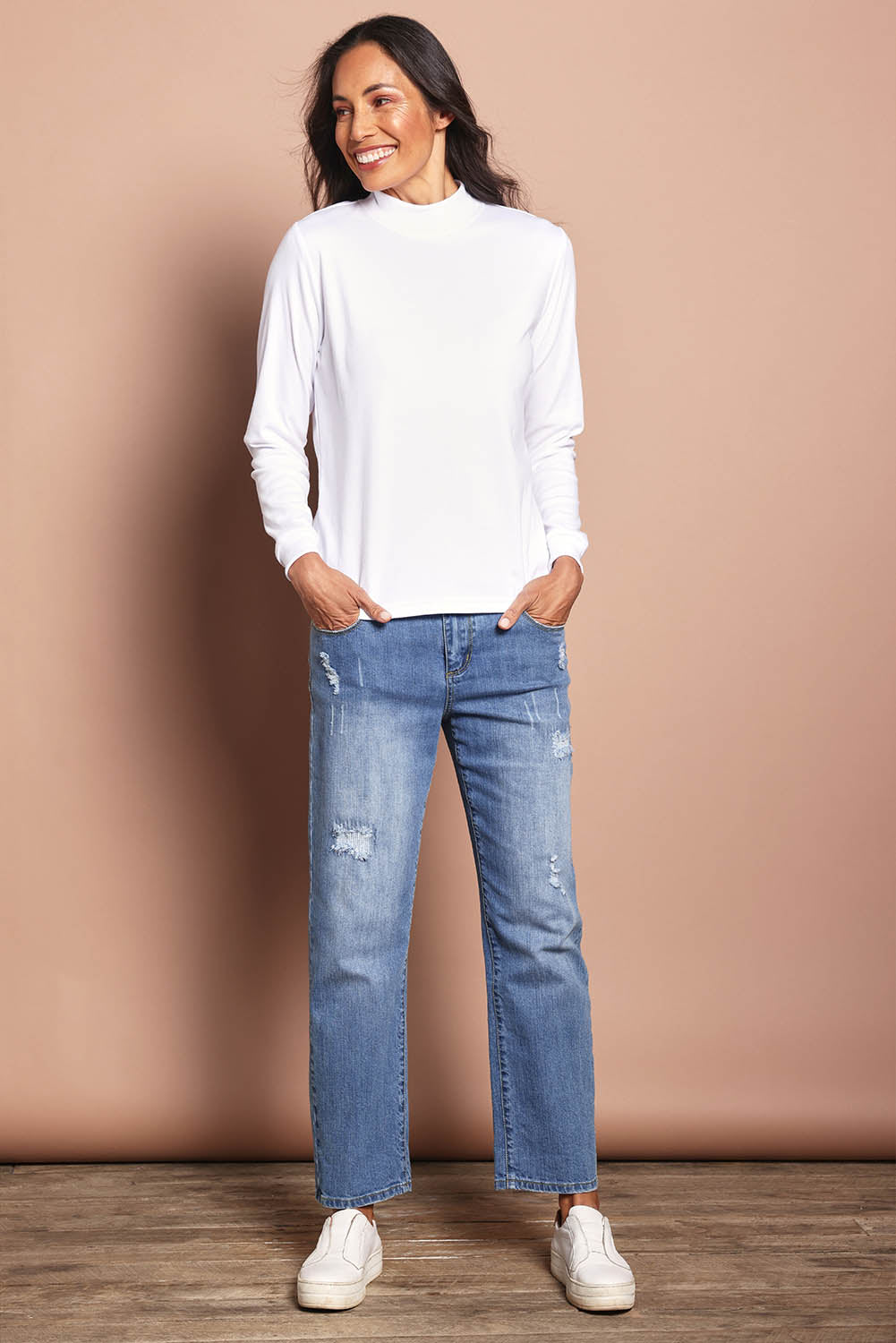 Model Amanda wearing size 10 of The Cotton Blend Skivvy in colour White (White), from the front, showing the whole outfit