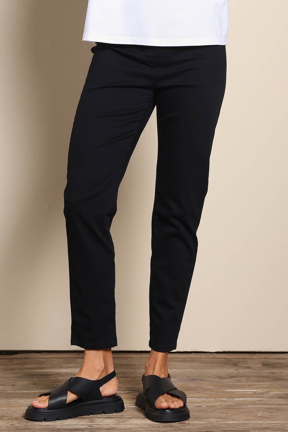 Model Amandam wearing size 10 of the The Cotton Pull On Stretch Comfort Pant – Black in colour Black, in a cropped view