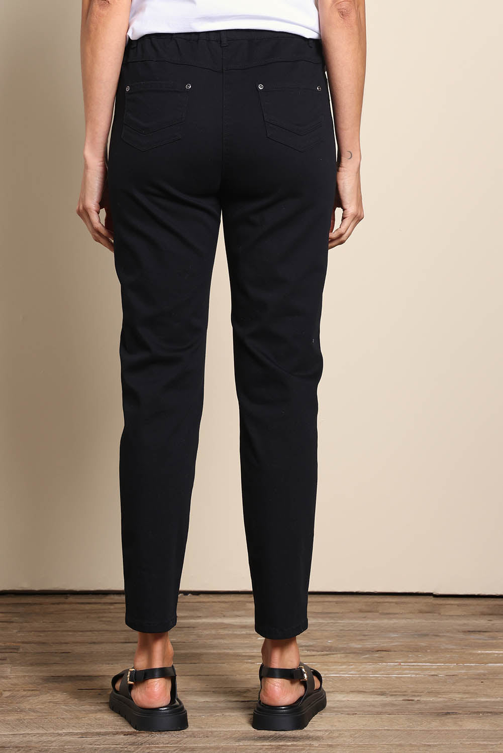 Model Amandam wearing size 10 of the The Cotton Pull On Stretch Comfort Pant – Black in colour Black, from the front