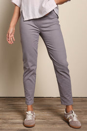 Model Amandam wearing size 10 of the The Cotton Pull On Stretch Comfort Pant – Latte in colour Latte, in a cropped view