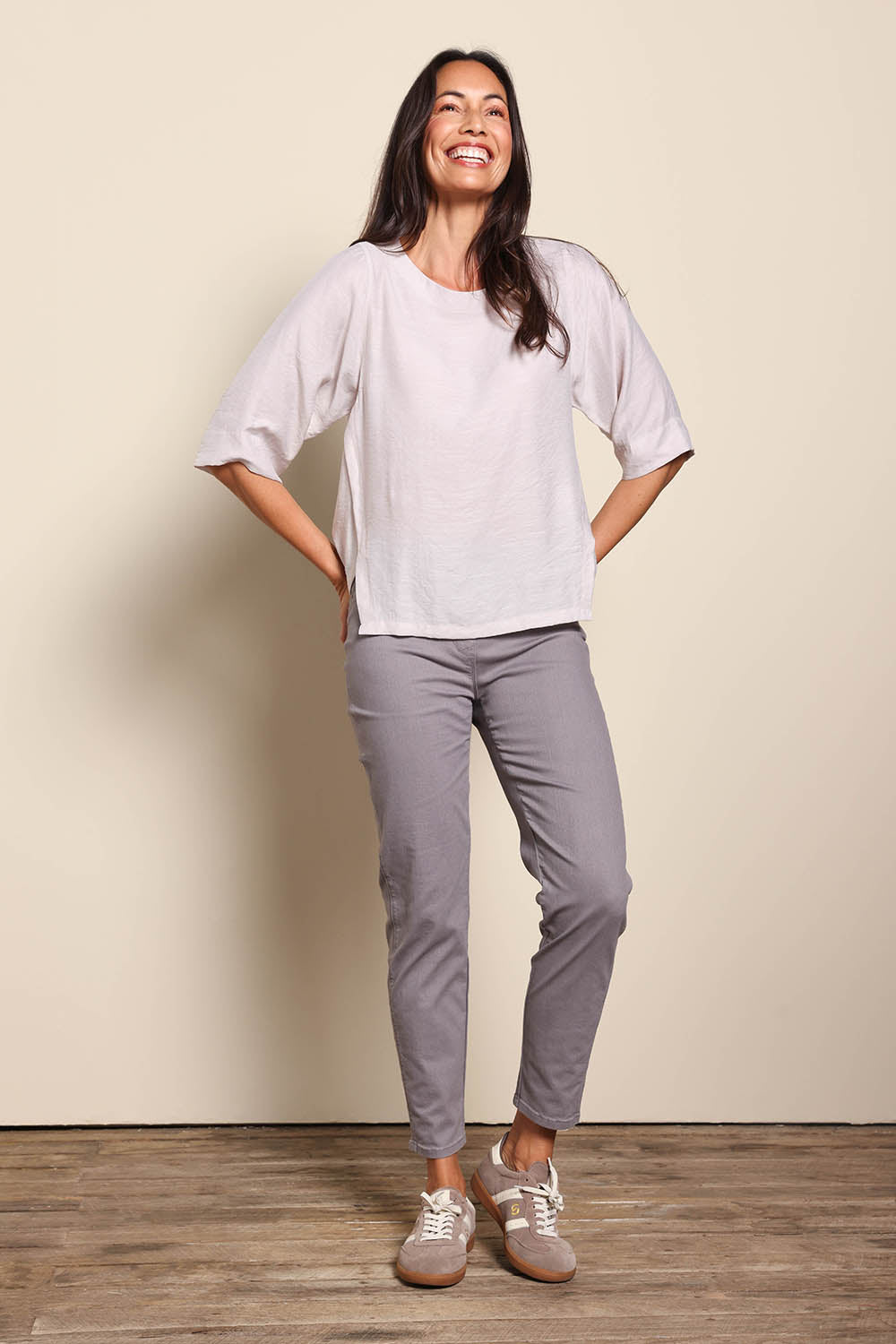 Model Amandam wearing size 10 of the The Cotton Pull On Stretch Comfort Pant – Latte in colour Latte, from the front
