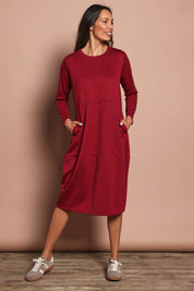 Model Amanda wearing size 10 of The Easy Wear Pocket Dress in colour Port (Red), from the front, showing the whole outfit