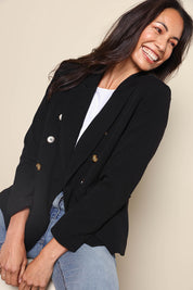 Model Amandam wearing size 10 of the The Classic Double Breasted Blazer – Black in colour Black, from an angle
