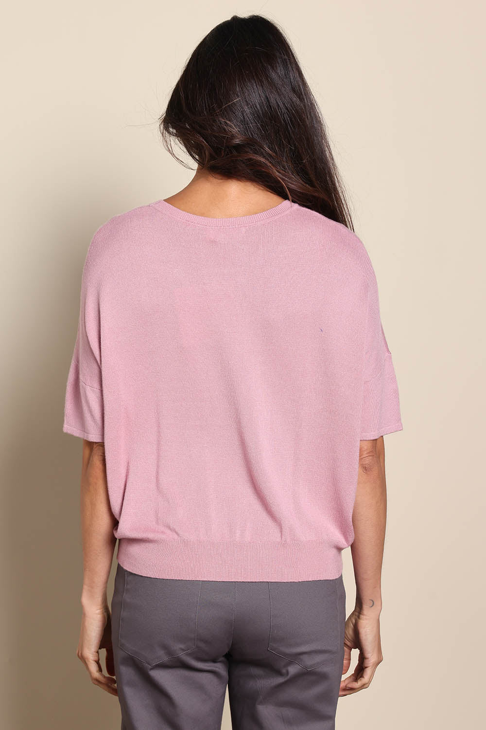 Model Amandam wearing size 10 of the The Essential Knit Tee – Blushcandy in colour Blushcandy, from the back