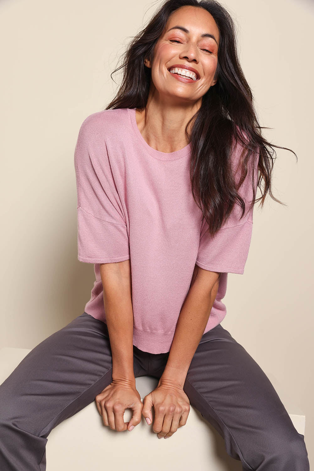 Model Amandam wearing size 10 of the The Essential Knit Tee – Blushcandy in colour Blushcandy, in a cropped view