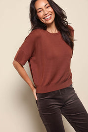 Model Amandam wearing size 10 of the The Essential Knit Tee – Copper in colour Copper, from an angle