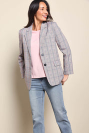 Model Amandam wearing size 10 of the The Summer Check Blazer – Greypink in colour Greypink, in a cropped view