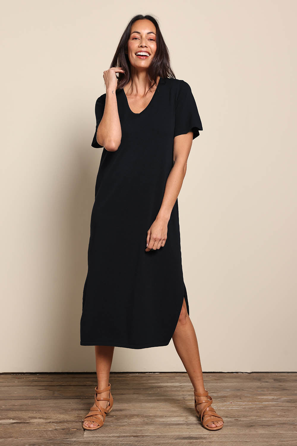 Model Amandam wearing size 10 of the The Summer Comfort True Knit Dress – Black in colour Black, from the front