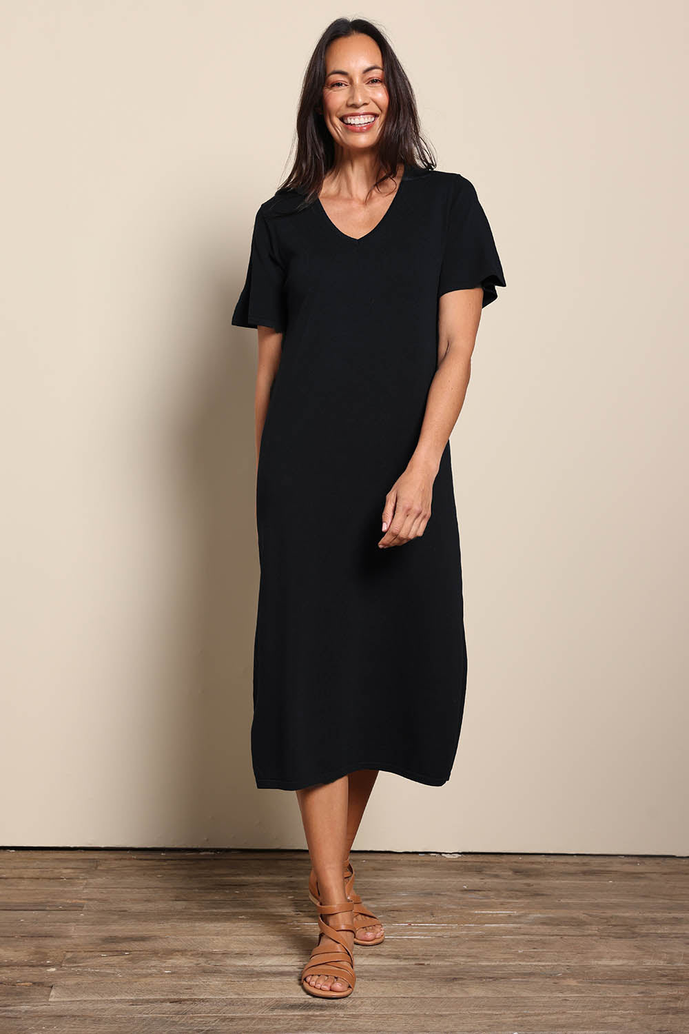 Model Amandam wearing size 10 of the The Summer Comfort True Knit Dress – Black in colour Black, from the front