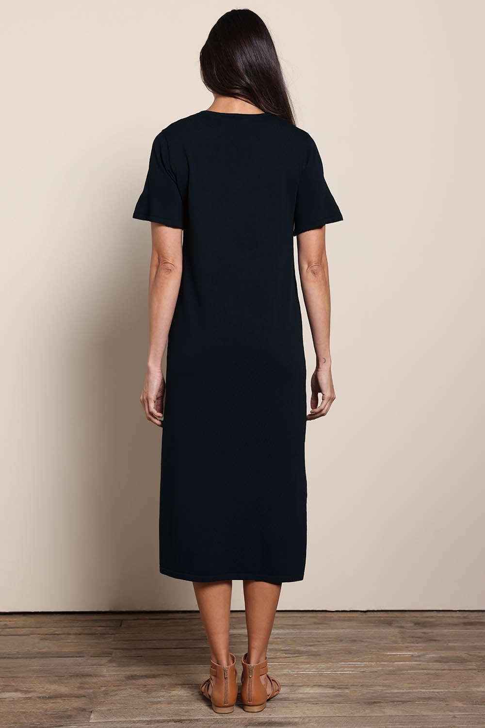 Model Amandam wearing size 10 of the The Summer Comfort True Knit Dress – Black in colour Black, from the front