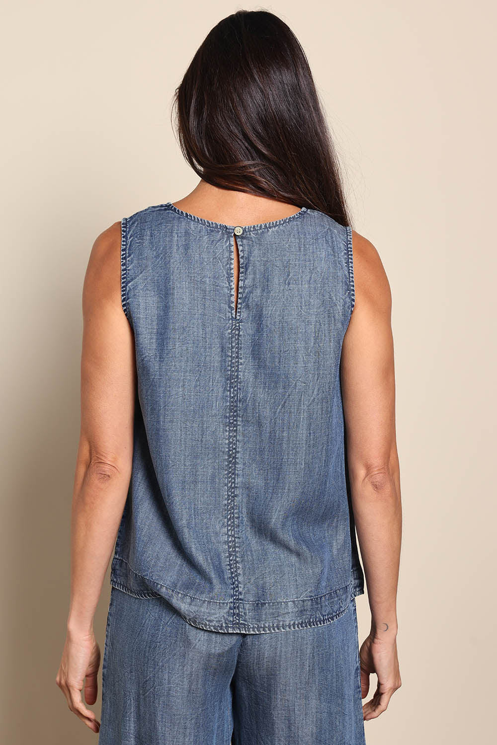 Model Amandam wearing size 10 of the The Luxe Lyocell Tank – Indigo in colour Indigo, from the back