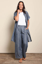 Model Amandam wearing size 10 of the The Luxe Lyocell Shacket Dress – Indigo in colour Indigo, from the front