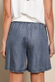 Model Amandam wearing size 10 of the The Luxe Lyocell Pull On Shorts – Indigo in colour Indigo, from the back