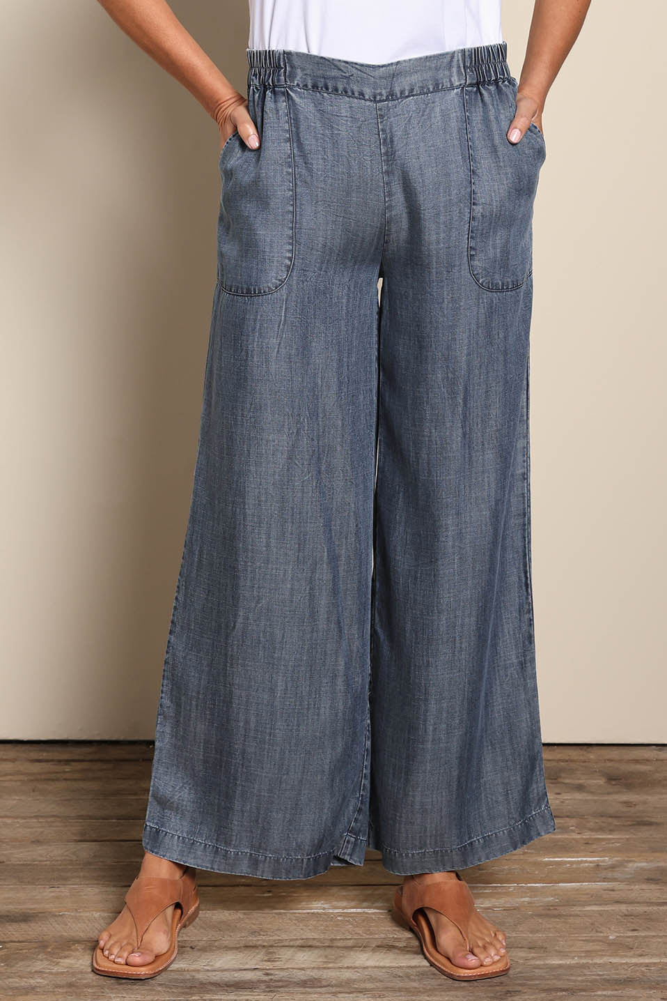 Model Amandam wearing size 10 of the The Luxe Lyocell Pull On Wide Leg Pant – Indigo in colour Indigo, in a cropped view