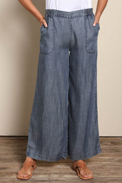 Model Amandam wearing size 10 of the The Luxe Lyocell Pull On Wide Leg Pant – Indigo in colour Indigo, in a cropped view