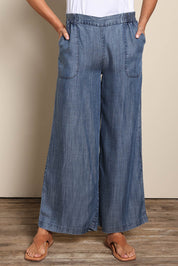 Model Amandam wearing size 10 of the The Luxe Lyocell Pull On Wide Leg Pant – Indigo in colour Indigo, in a cropped view
