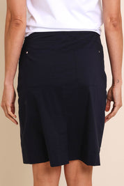 Model Amandam wearing size 10 of the The Lightweight Cotton Blend Stretch Skirt – Navy in colour Navy, from the back