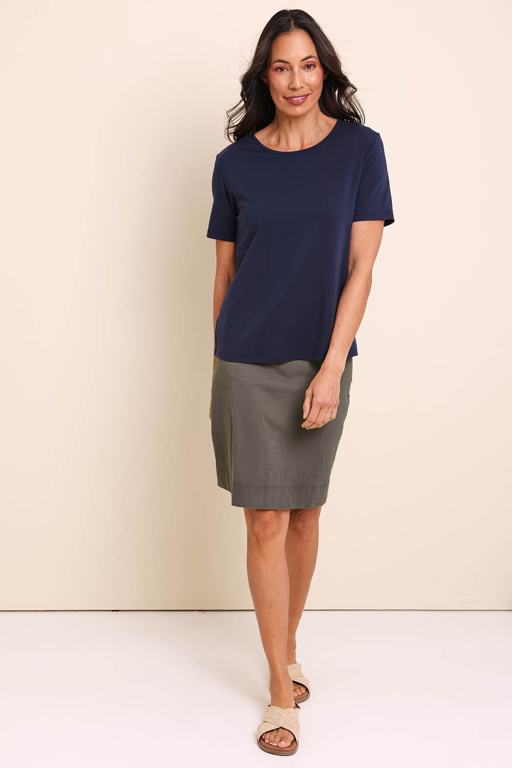 Model Amandam wearing size 10 of the The Lightweight Cotton Blend Stretch Skirt – Olive in colour Olive, from the front