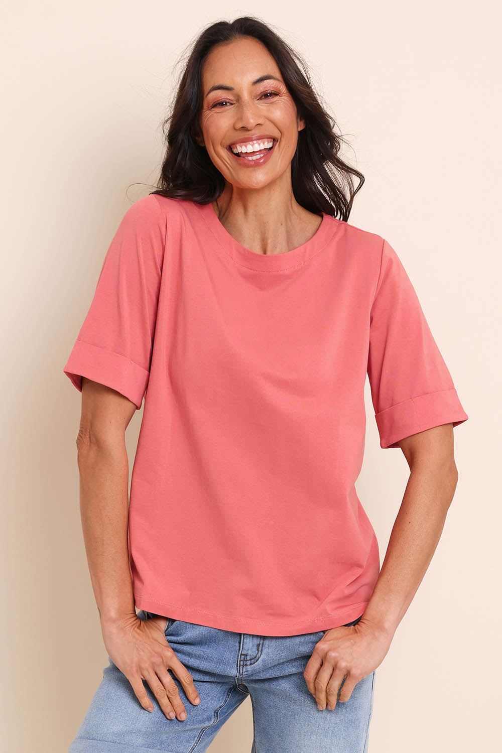 Model Amandam wearing size 10 of the The Keepers Relaxed Fit Tee – Papaya in colour Papaya, in a cropped view