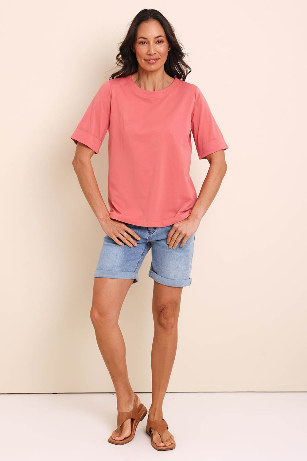 Model Amandam wearing size 10 of the The Keepers Relaxed Fit Tee – Papaya in colour Papaya, from the front