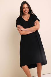 Model Amandam wearing size 10 of the The Easy Wear Bamboo Tee Dress – Black in colour Black, from the front