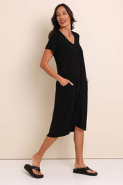 Model Amandam wearing size 10 of the The Easy Wear Bamboo Tee Dress – Black in colour Black, from the front