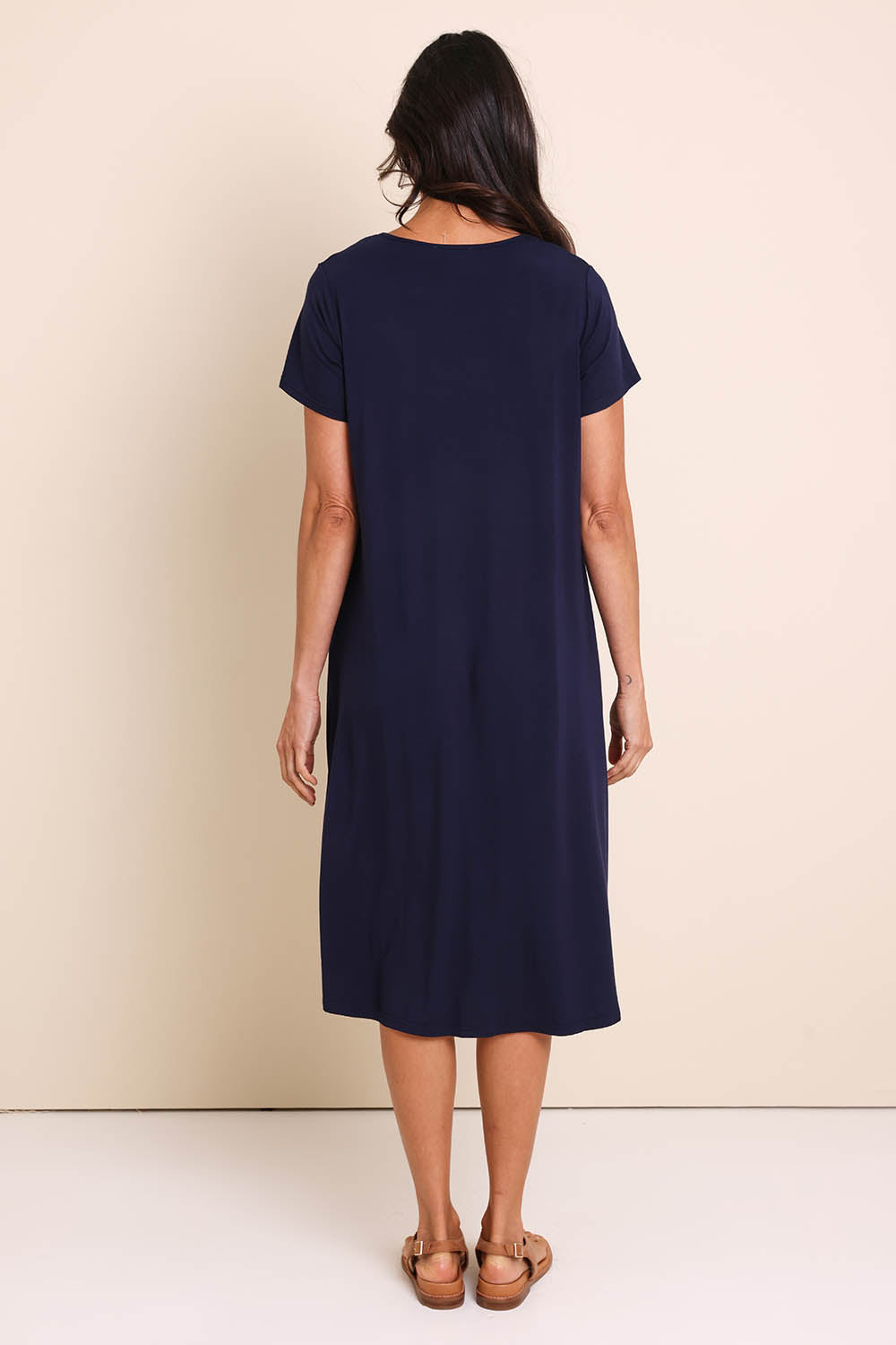 Model Amandam wearing size 10 of the The Easy Wear Bamboo Tee Dress – Navy in colour Navy, from the front