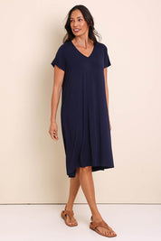 Model Amandam wearing size 10 of the The Easy Wear Bamboo Tee Dress – Navy in colour Navy, from the front