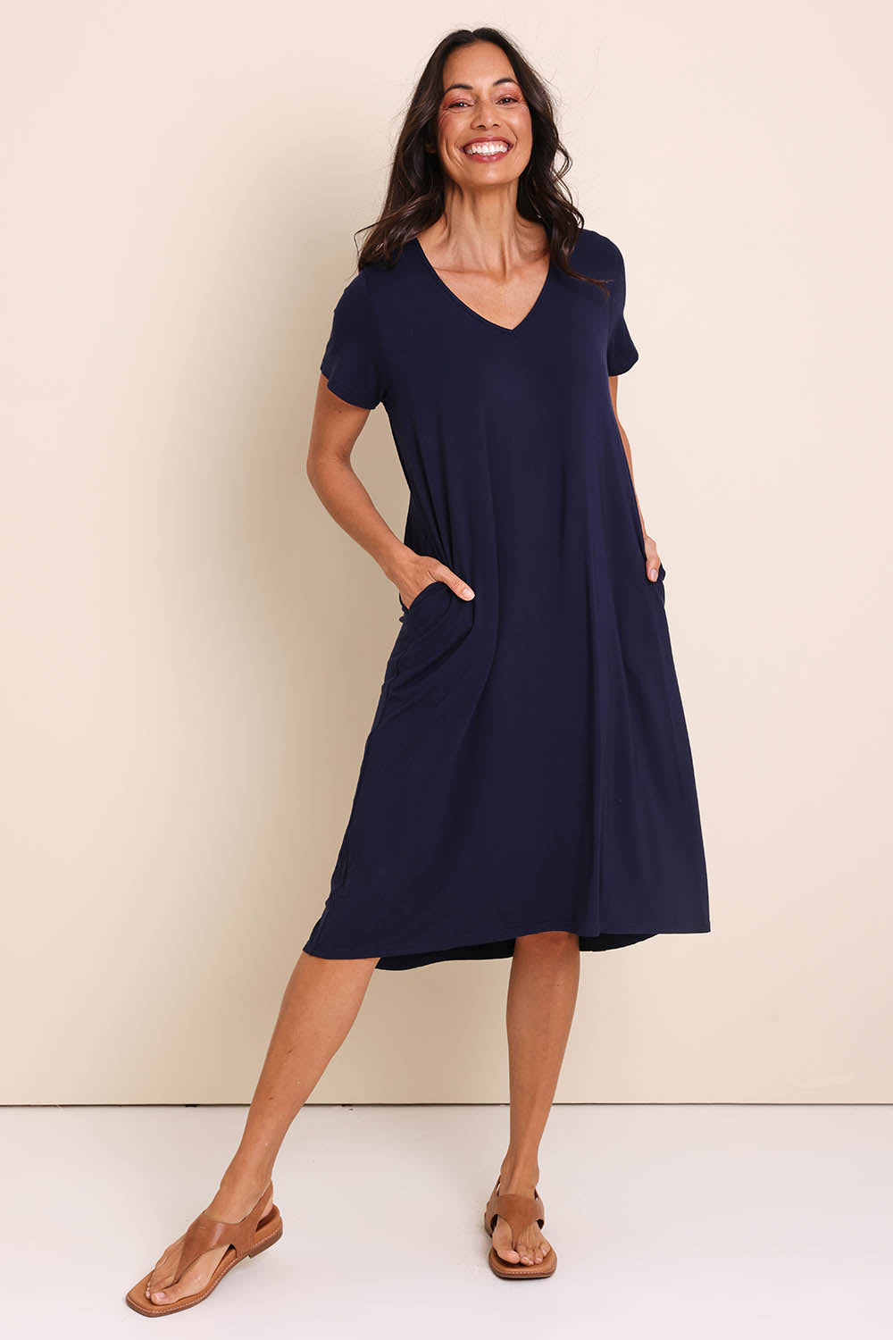 Model Amandam wearing size 10 of the The Easy Wear Bamboo Tee Dress – Navy in colour Navy, from the front