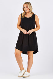Model Jess wearing size 12 of The Sleeveless Swing Dress in colour WashBlack (Black), from the front, showing the whole outfit
