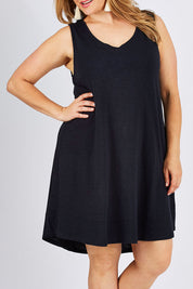 Model Ljubenka wearing size 18 of The Sleeveless Swing Dress in colour WashBlack (Black), from the front, cropped image