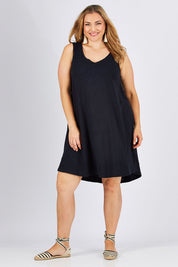 Model Ljubenka wearing size 18 of The Sleeveless Swing Dress in colour WashBlack (Black), from the front, showing the whole outfit