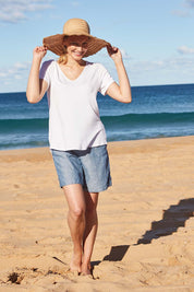 Model Alex wearing size 8 of The Bamboo Tee in colour White (White), from the front, showing the whole outfit