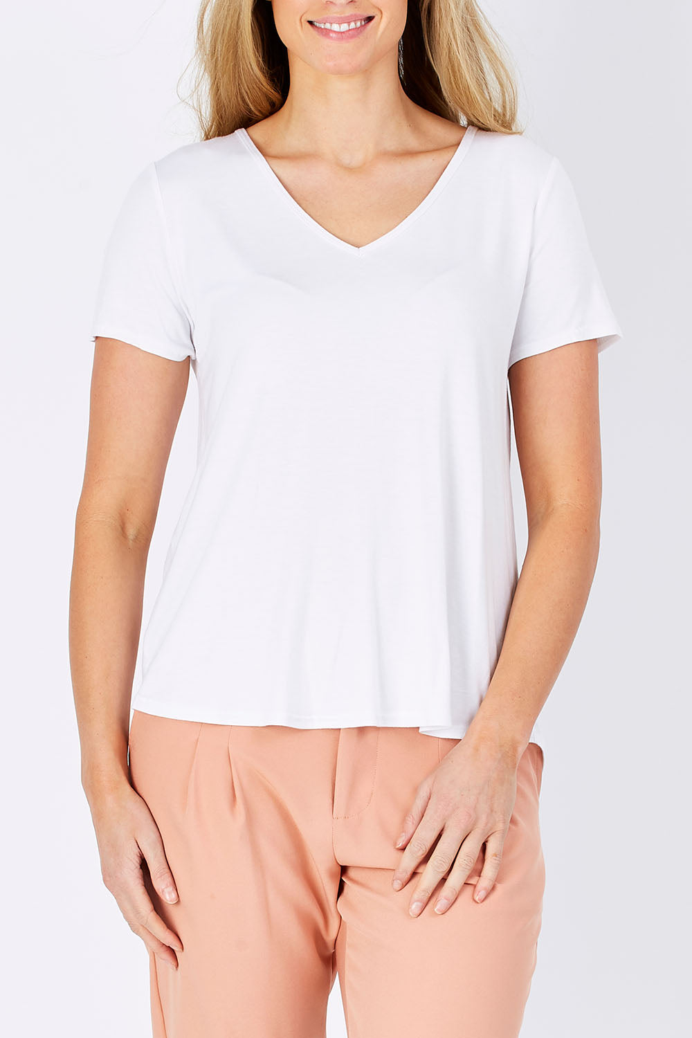 Model Maddy wearing size 10 of The Bamboo Tee in colour White (White), from the front, cropped image