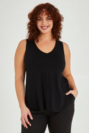 Model Maddy wearing size 16 of The Bamboo Tank in colour Black (Black), from the front, cropped image