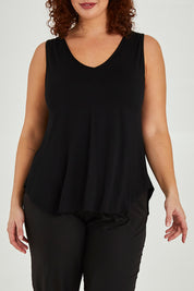 Model Maddy wearing size 16 of The Bamboo Tank in colour Black (Black), from the front, cropped image