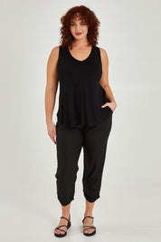 Model Maddy wearing size 16 of The Bamboo Tank in colour Black (Black), from the front, showing the whole outfit