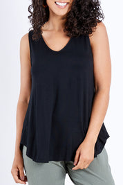Model Pamela wearing size 10 of The Bamboo Tank in colour Black (Black), from the front, cropped image