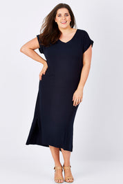 Model Jess wearing size 16 of The Mid Length Tee Dress in colour Navy (Blue), from the front, showing the whole outfit