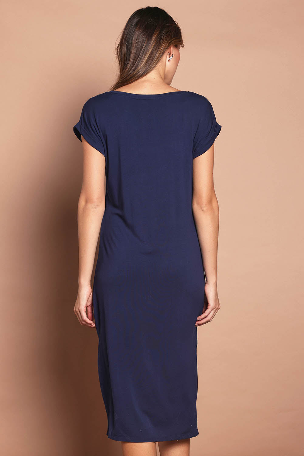 Model Madeline wearing size 10 of The Mid Length Tee Dress in colour Navy (Blue), from the back