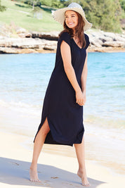 Model Rebecca wearing size 10 of The Mid Length Tee Dress in colour Navy (Blue), from the front, showing the whole outfit